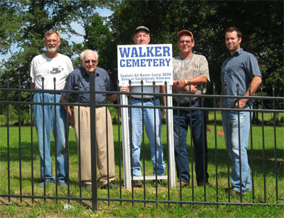 members of 2034 by the Walker Cemetery Sign