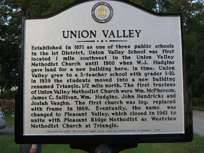 members of 2034 by the Rials-Sullivan Cemetery Sign