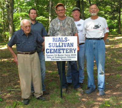 members of 2034 by the Rials-Sullivan Cemetery Sign